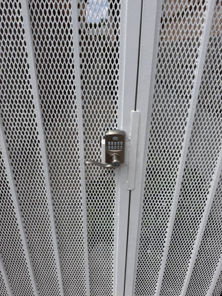 Finished pedestrian gate with upgraded keypad after repaint work in Van Nuys