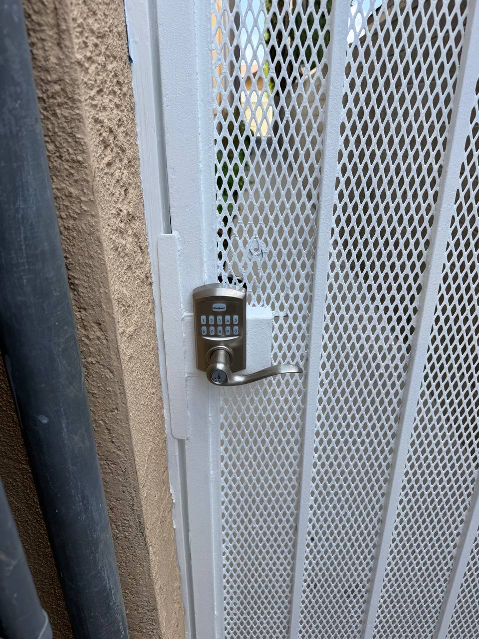 Smart lock keypad detail on pedestrian gate