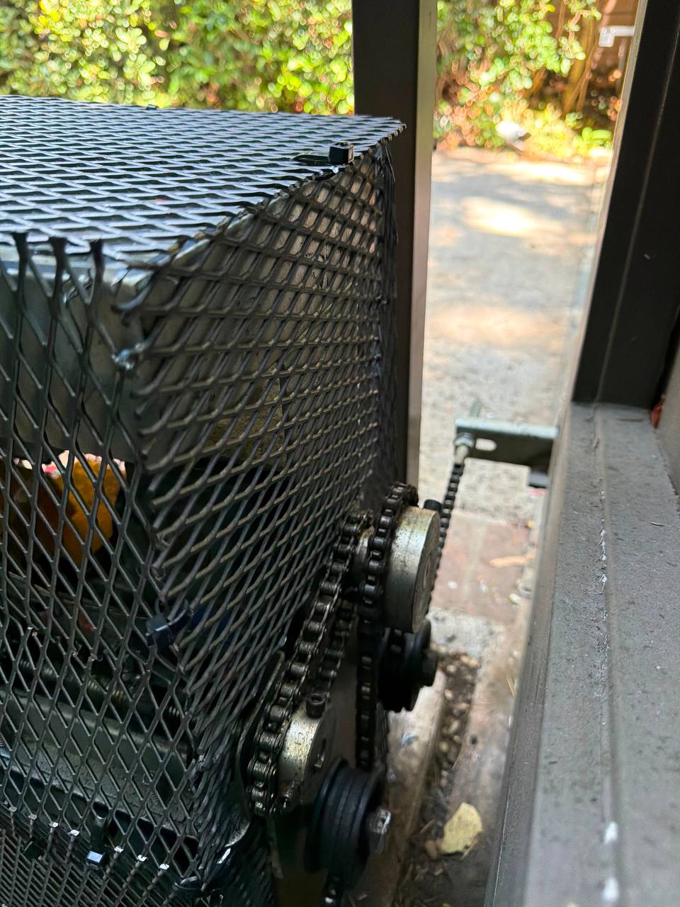 Chain and drive area protected by anti-rat motor cage