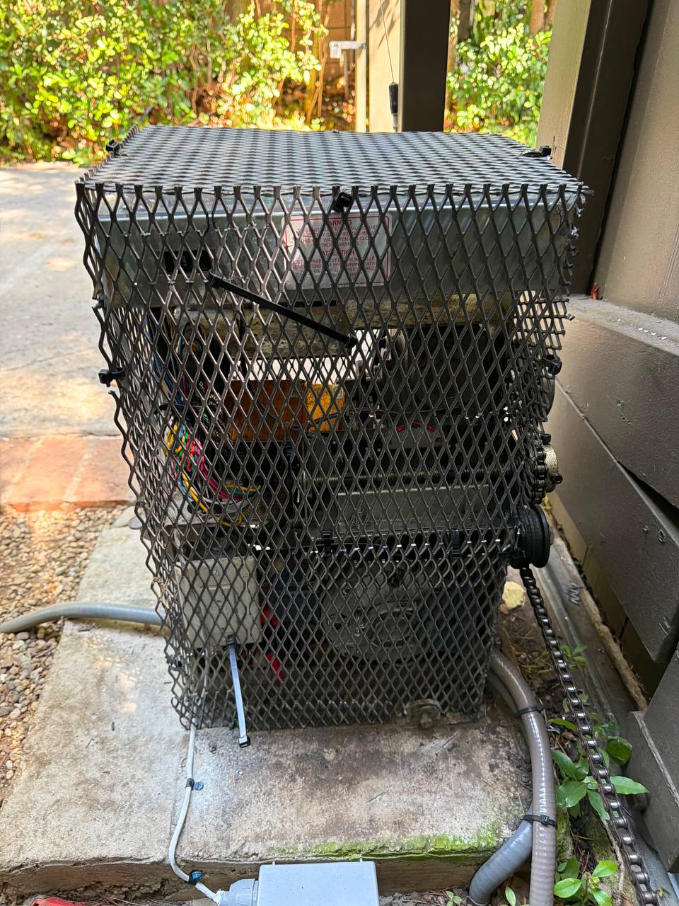 Front operator view showing custom anti-rat motor cage