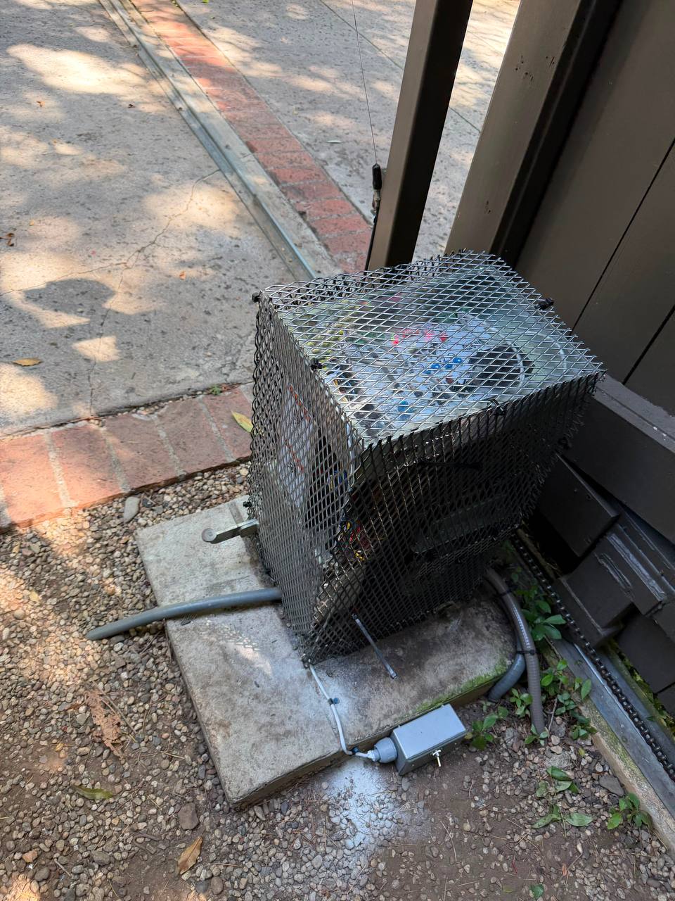 Anti-rat metal motor cage around sliding gate operator in Brentwood